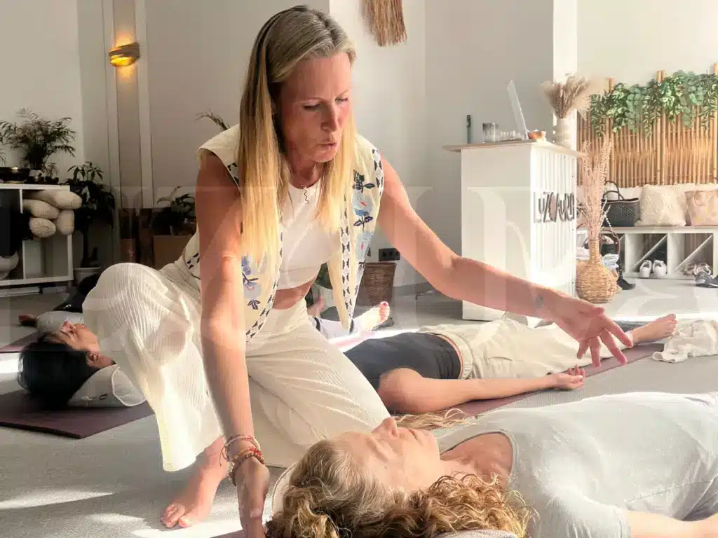 Yoga instructor guiding a relaxation session at Luz Aura.