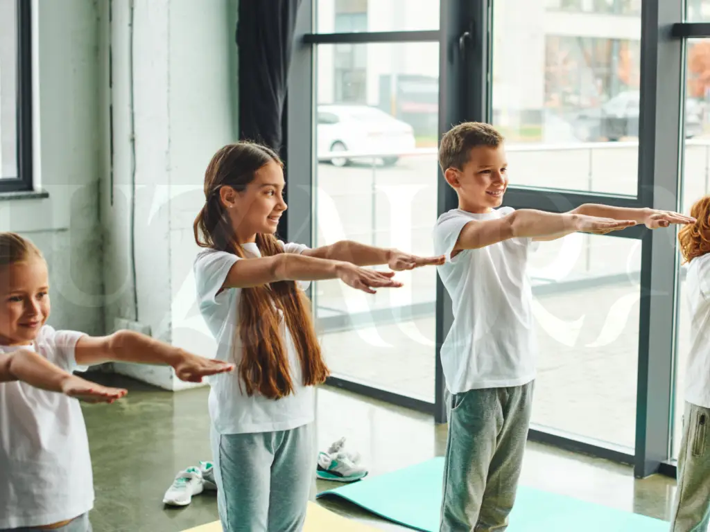 Children practising yoga together at Luz Aura.